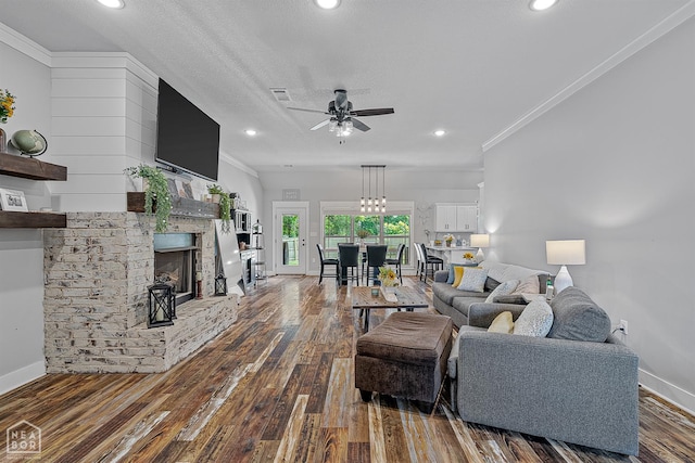 4317 Cypress Pointe Ln, Jonesboro, AR 72405 - living area featuring ornamental molding, hardwood / wood-style floors, a ceiling fan, a fireplace, and recessed lighting