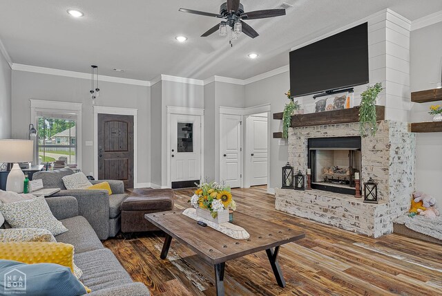 4317 Cypress Pointe Ln, Jonesboro, AR 72405 - living room with wood finished floors, ceiling fan, crown molding, a fireplace, and recessed lighting