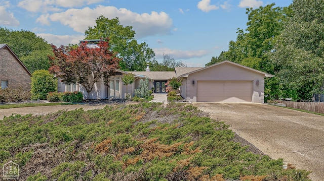 106 Winston Pl, Paragould, AR 72450 - ranch-style home with an attached garage and concrete driveway