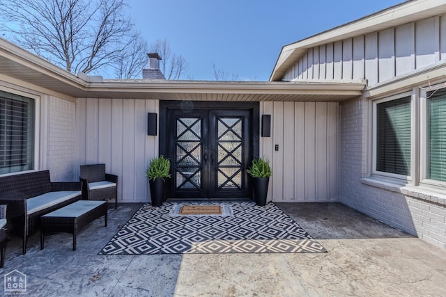 106 Winston Pl, Paragould, AR 72450 - entrance to property with board and batten siding, brick siding, and a chimney