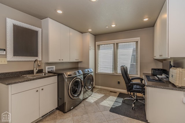 106 Winston Pl, Paragould, AR 72450 - washroom featuring washing machine and dryer, cabinet space, recessed lighting, light tile patterned flooring, and baseboards