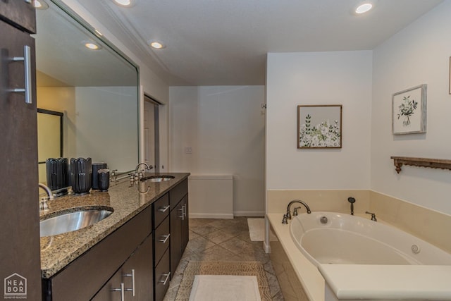 106 Winston Pl, Paragould, AR 72450 - full bath featuring a bath, double vanity, recessed lighting, and baseboards