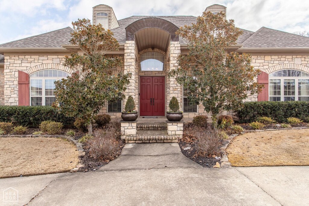 2914 Ridgepointe Dr, Jonesboro, AR 72404 - view of front of property featuring a shingled roof and stone siding
