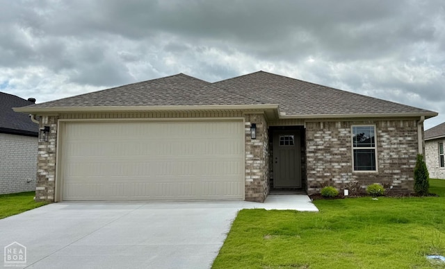 5709 Morgan Dr, Jonesboro, AR 72401 - view of front of property with driveway, an attached garage, a shingled roof, and a front lawn