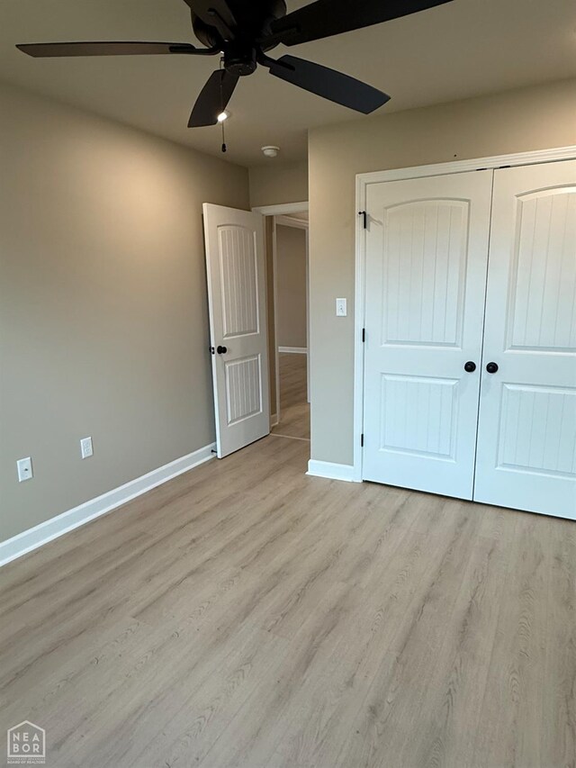 5709 Morgan Dr, Jonesboro, AR 72401 - unfurnished bedroom featuring baseboards, light wood-style floors, a closet, and ceiling fan