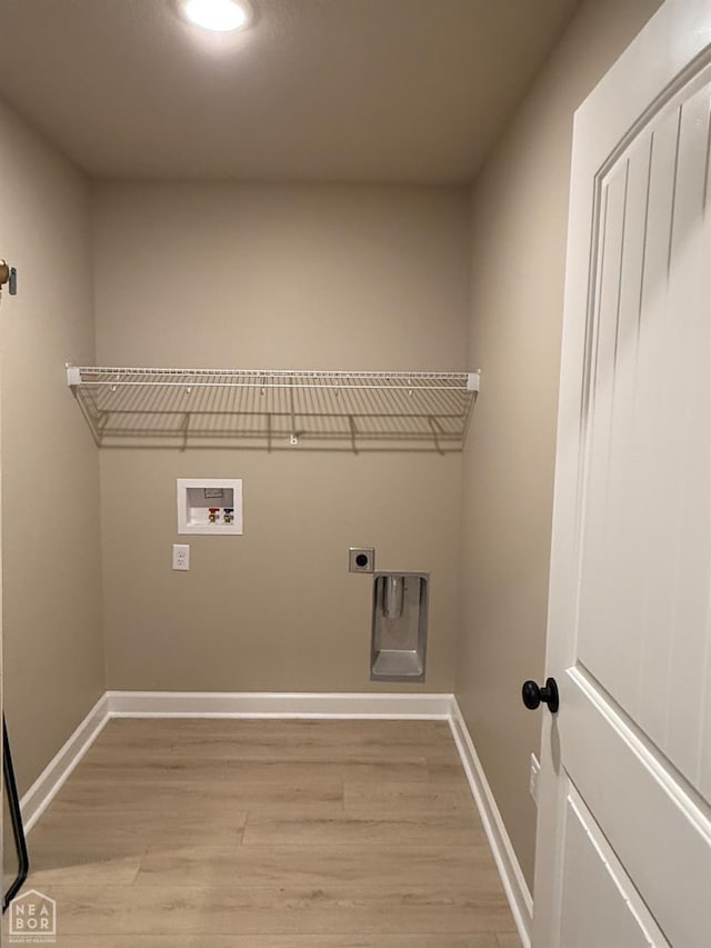 5709 Morgan Dr, Jonesboro, AR 72401 - washroom with light wood-style floors, baseboards, hookup for a washing machine, hookup for an electric dryer, and recessed lighting