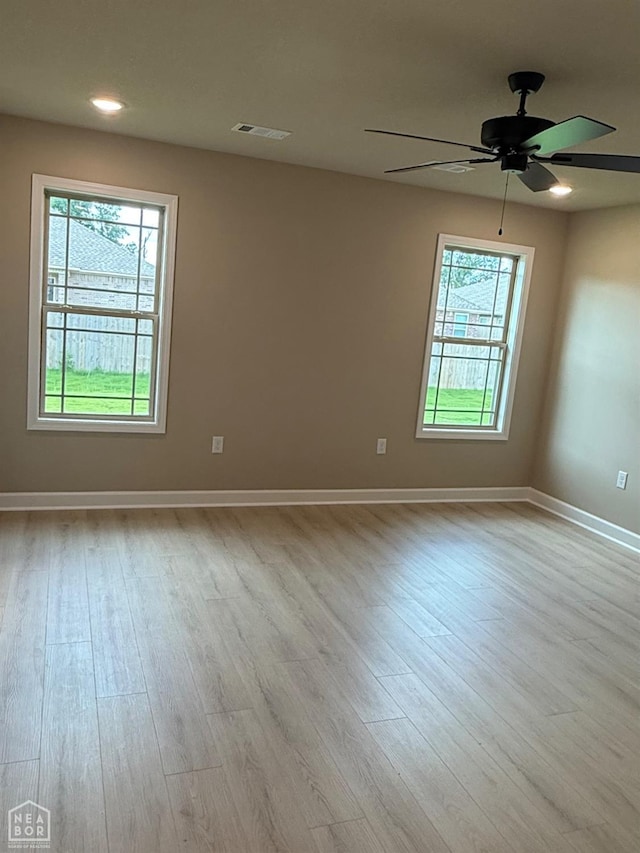 5709 Morgan Dr, Jonesboro, AR 72401 - spare room with wood finished floors, baseboards, ceiling fan, and recessed lighting