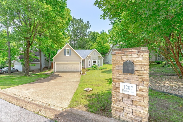 1207 Hunters Run Cv, Jonesboro, AR 72401 - view of front facade featuring concrete driveway, a front lawn, and an attached garage