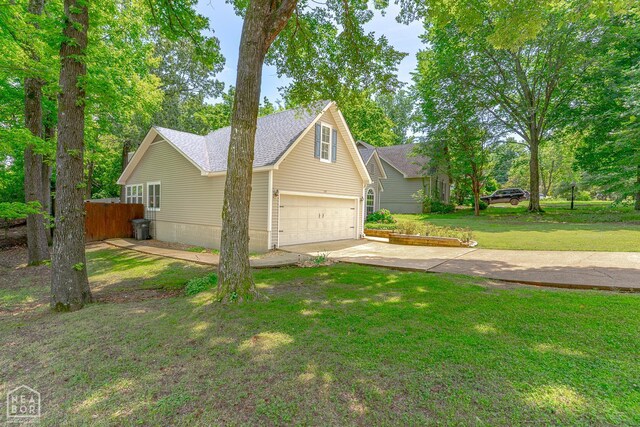 1207 Hunters Run Cv, Jonesboro, AR 72401 - view of property exterior with concrete driveway, a garage, and a shingled roof
