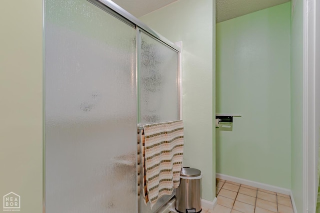 1207 Hunters Run Cv, Jonesboro, AR 72401 - bathroom with tile patterned floors, an enclosed shower, and baseboards