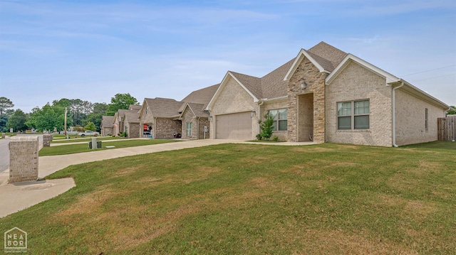 107 Hidden Creek St, Brookland, AR 72417 - view of front of property with concrete driveway, a front lawn, an attached garage, and brick siding