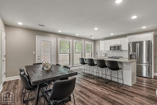 2100 N 29th St, Paragould, AR 72450 - dining room with recessed lighting, baseboards, dark wood-style floors, and visible vents