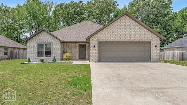 2100 N 29th St, Paragould, AR 72450 - ranch-style home with fence, a garage, driveway, and a front yard