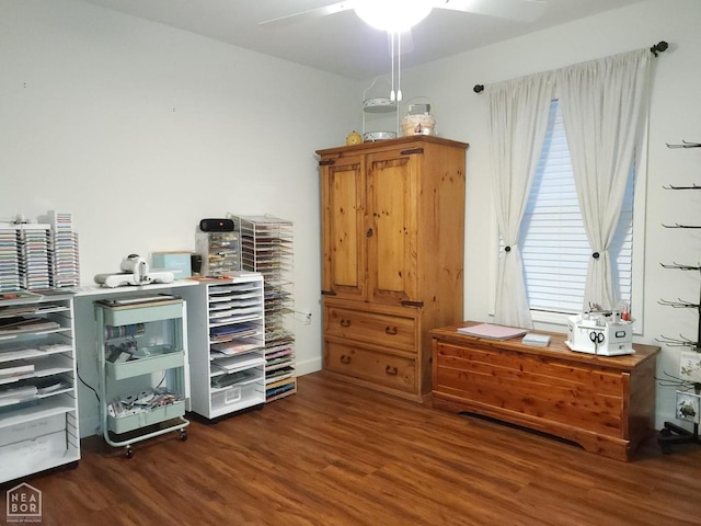 misc room with a ceiling fan and wood finished floors