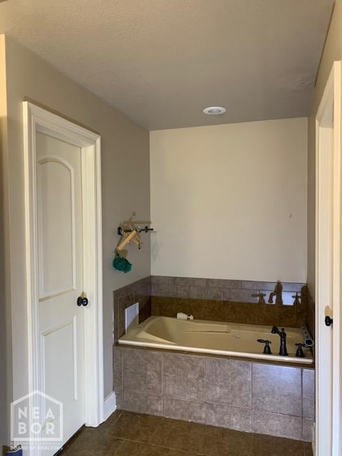 4709 Summit Ridge Dr, Jonesboro, AR 72404 - bathroom featuring a bath and tile patterned floors