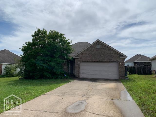4709 Summit Ridge Dr, Jonesboro, AR 72404 - view of front facade featuring concrete driveway, brick siding, a front lawn, and an attached garage
