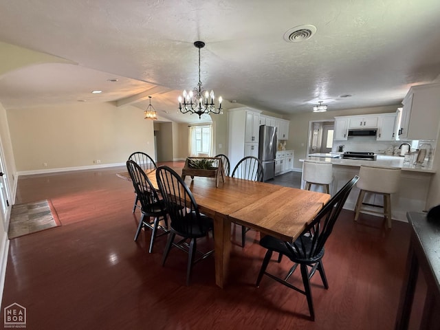 1354 Wiley Dr, Piggott, AR 72454 - dining area featuring dark wood-type flooring, vaulted ceiling, and a chandelier