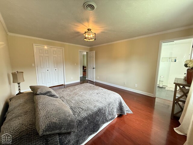 1354 Wiley Dr, Piggott, AR 72454 - bedroom featuring wood finished floors, ornamental molding, and a closet