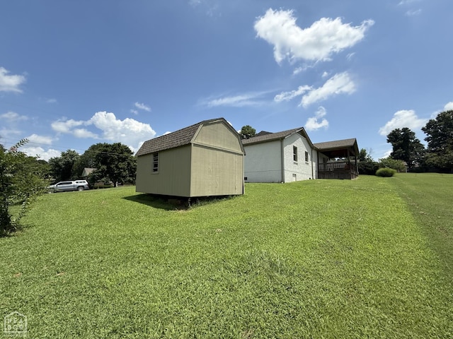 1354 Wiley Dr, Piggott, AR 72454 - view of green lawn featuring a storage shed