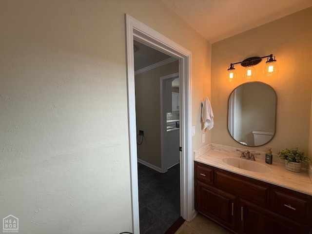 1354 Wiley Dr, Piggott, AR 72454 - bathroom featuring vanity, ornamental molding, and tile patterned flooring