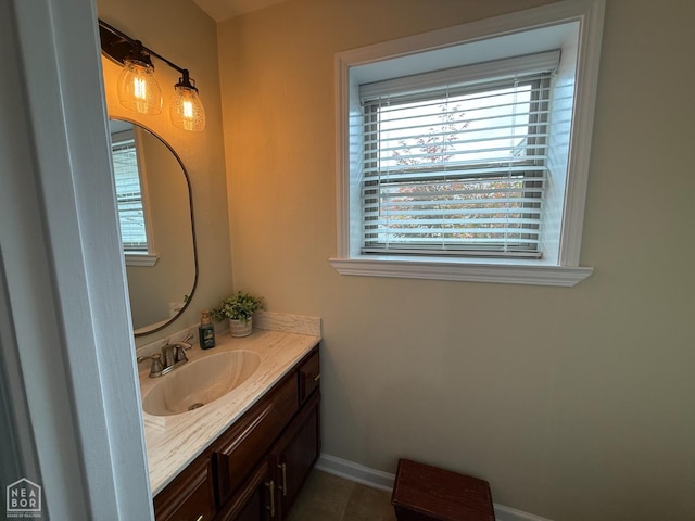 1354 Wiley Dr, Piggott, AR 72454 - bathroom featuring plenty of natural light, vanity, and tile patterned flooring