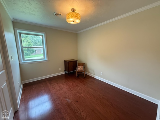 1354 Wiley Dr, Piggott, AR 72454 - empty room with dark wood-style flooring and crown molding