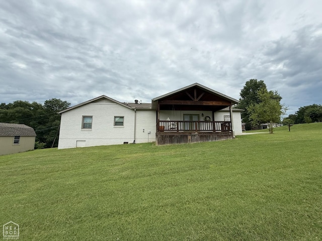 1354 Wiley Dr, Piggott, AR 72454 - rear view of house featuring a yard