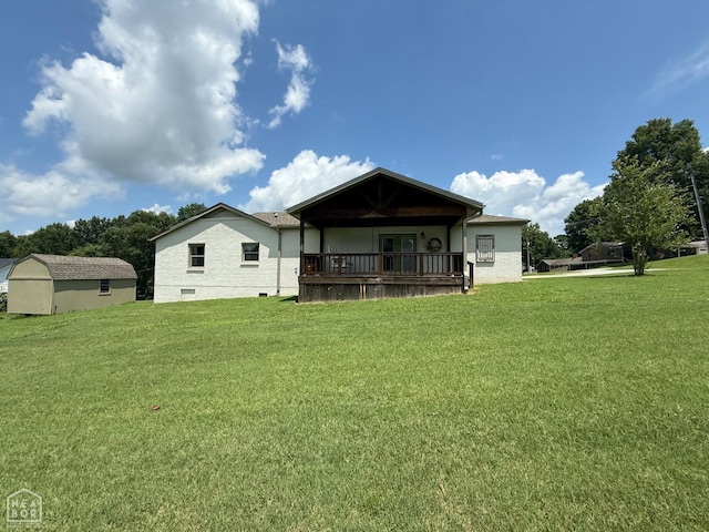 1354 Wiley Dr, Piggott, AR 72454 - back of house with a lawn, crawl space, and a storage unit