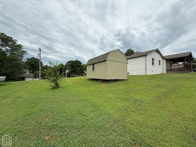 1354 Wiley Dr, Piggott, AR 72454 - view of green lawn featuring a shed