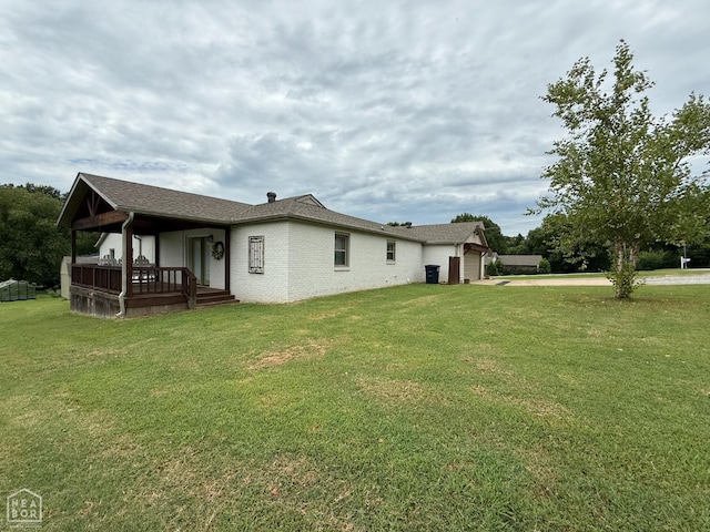 1354 Wiley Dr, Piggott, AR 72454 - view of property exterior featuring driveway, a lawn, a garage, and brick siding