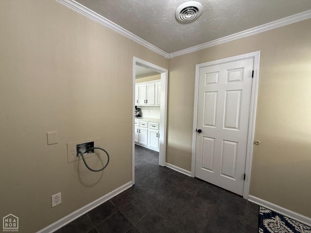 1354 Wiley Dr, Piggott, AR 72454 - laundry area with washer hookup, ornamental molding, and dark tile patterned floors