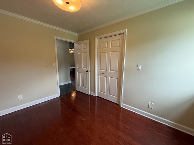 1354 Wiley Dr, Piggott, AR 72454 - unfurnished bedroom with wood finished floors, a closet, and ornamental molding