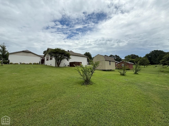 1354 Wiley Dr, Piggott, AR 72454 - view of green lawn featuring an outbuilding