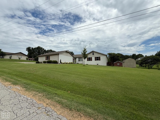 1354 Wiley Dr, Piggott, AR 72454 - view of front of house with a shed and a front yard