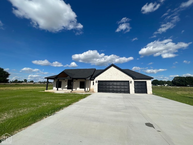 812 Pecan Grv, Trumann, AR 72472 - view of front facade with an attached garage, a front yard, and concrete driveway
