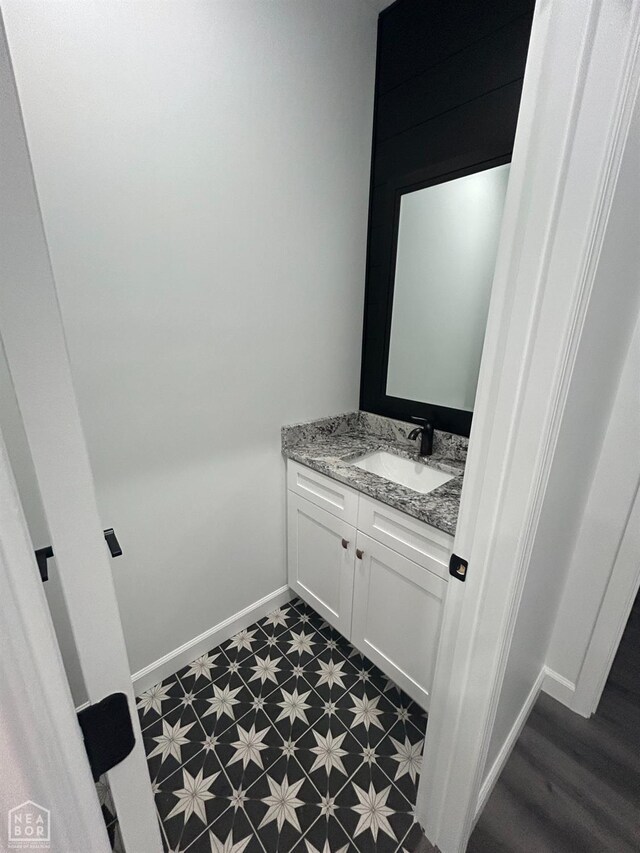 812 Pecan Grv, Trumann, AR 72472 - bathroom featuring vanity and baseboards