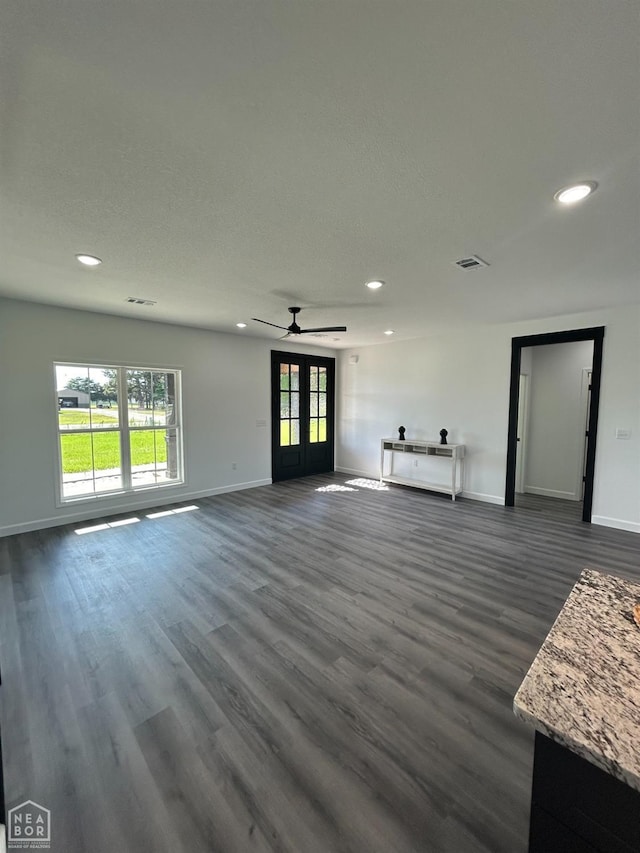 812 Pecan Grv, Trumann, AR 72472 - unfurnished living room with baseboards, recessed lighting, dark wood-style floors, healthy amount of natural light, and ceiling fan
