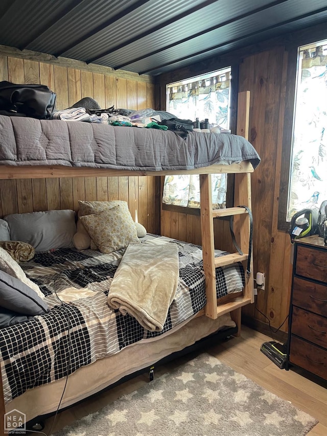 2052 Central Blvd, Bull Shoals, AR 72619 - bedroom featuring wood finished floors and wood walls