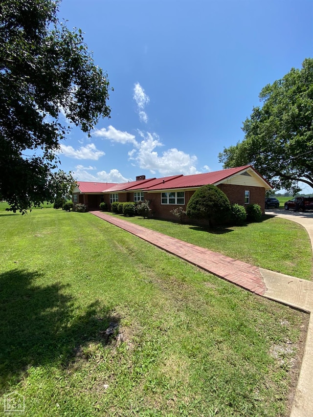 3969 NE State Highway 239, Blytheville, AR 72315 - view of front facade featuring a front lawn and brick siding