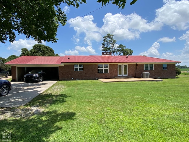 3969 NE State Highway 239, Blytheville, AR 72315 - view of front facade with an attached garage, driveway, brick siding, and a metal roof