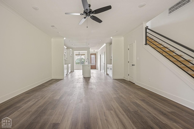 3428 Hudson Dr, Jonesboro, AR 72405 - unfurnished living room featuring crown molding, a ceiling fan, visible vents, dark wood-style flooring, and baseboards