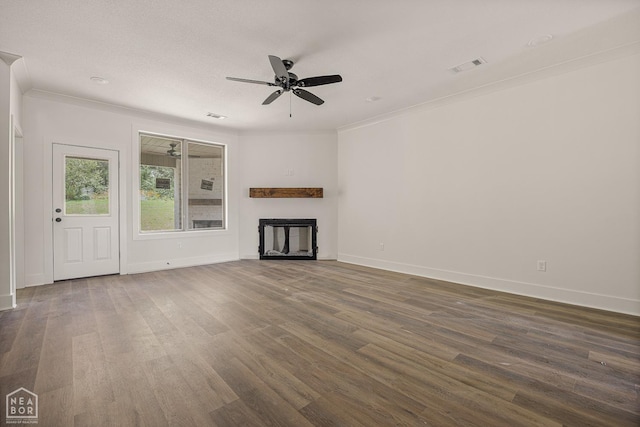 3428 Hudson Dr, Jonesboro, AR 72405 - unfurnished living room with ornamental molding, dark wood finished floors, and visible vents