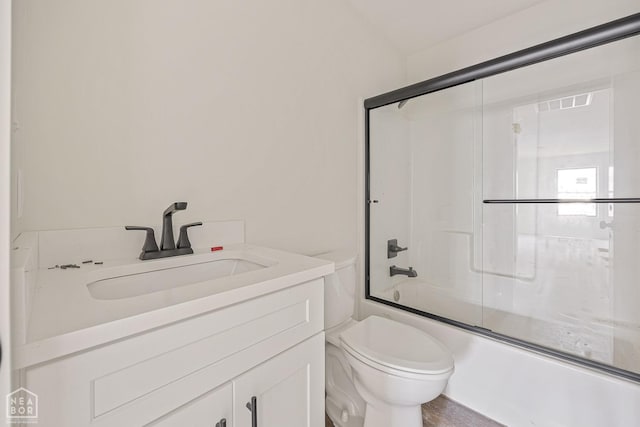 3428 Hudson Dr, Jonesboro, AR 72405 - full bathroom featuring toilet, combined bath / shower with glass door, and vanity