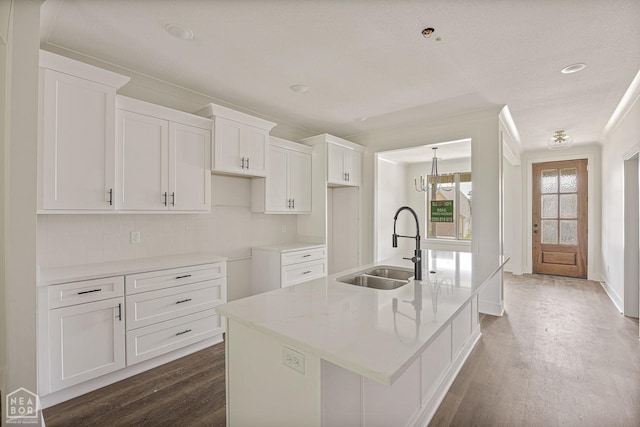 3428 Hudson Dr, Jonesboro, AR 72405 - kitchen featuring white cabinets, a kitchen island with sink, dark wood-style floors, and a sink