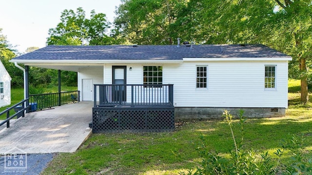 1205 Sims Ave, Jonesboro, AR 72401 - rear view of house with concrete driveway, a lawn, covered porch, a carport, and roof with shingles