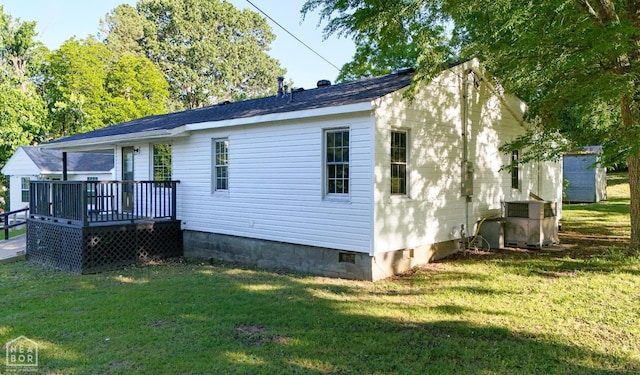 1205 Sims Ave, Jonesboro, AR 72401 - view of front facade with a deck, crawl space, a front lawn, and central air condition unit