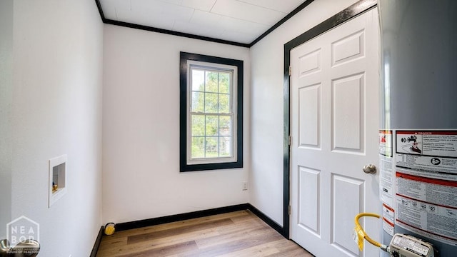 1205 Sims Ave, Jonesboro, AR 72401 - entryway featuring gas water heater, crown molding, light wood-style flooring, and baseboards