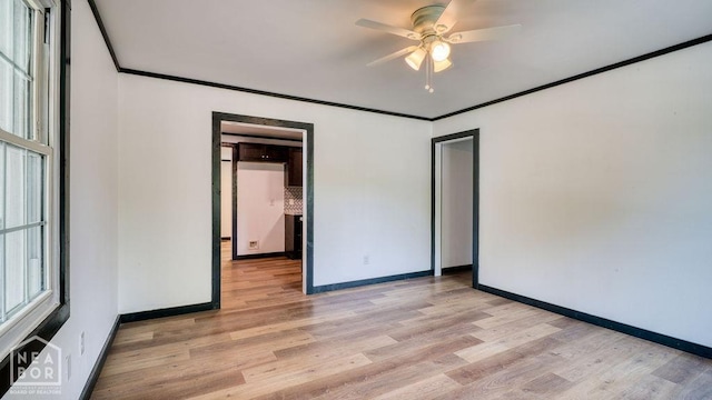 1205 Sims Ave, Jonesboro, AR 72401 - unfurnished bedroom with baseboards, light wood-style flooring, crown molding, and a ceiling fan