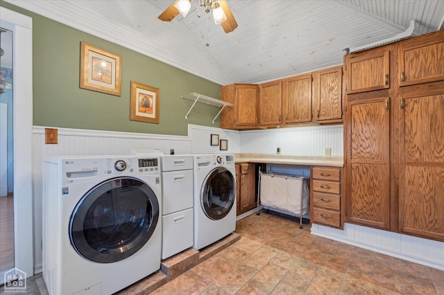 laundry room featuring independent washer and dryer, a ceiling fan, wood ceiling, wainscoting, and cabinet space