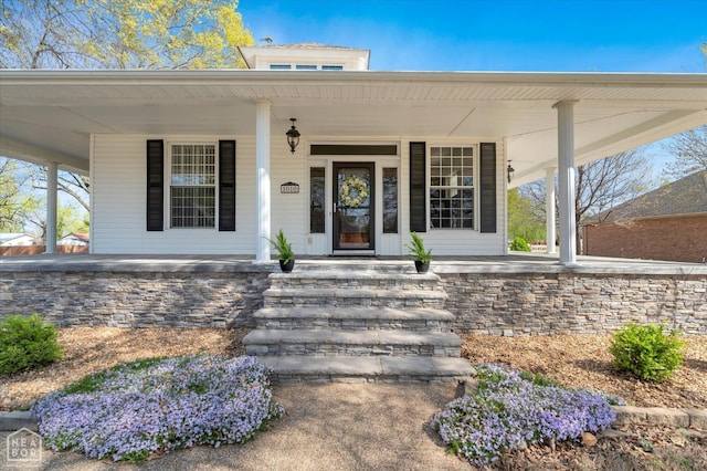 entrance to property with a porch